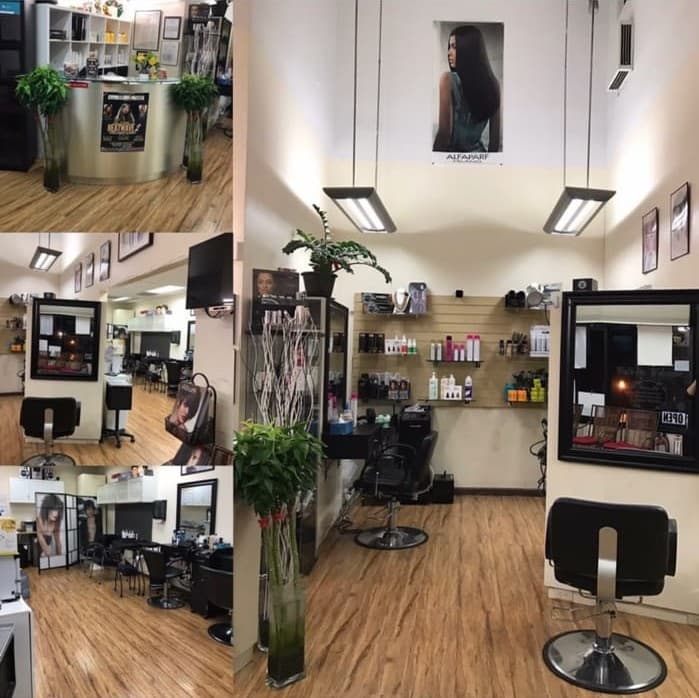 Spacious salon interior with styling chairs, mirrors, and product displays at Zion Salon & Barber Shop in National City.